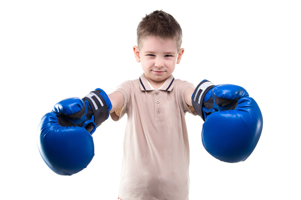 Smiling little boy and boxing gloves - Photo, Image