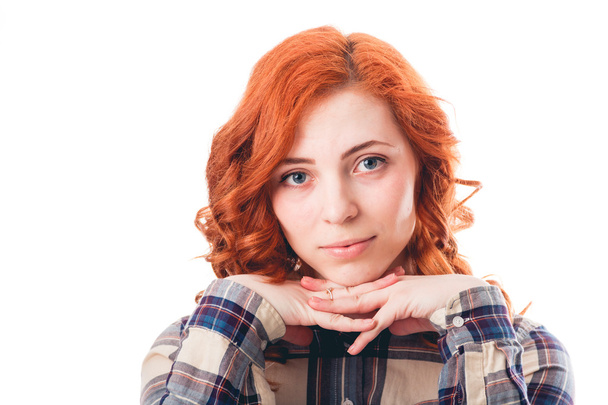 Young woman leaning on her hands, isolated over white background - Valokuva, kuva