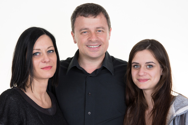 Pretty smiling family on a white background - Foto, Bild