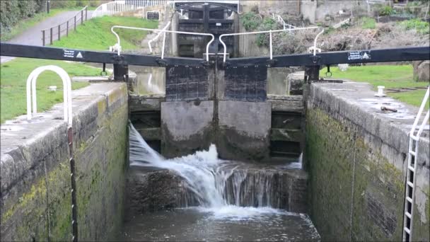 Canal lock cill with water spilling through gate - Footage, Video