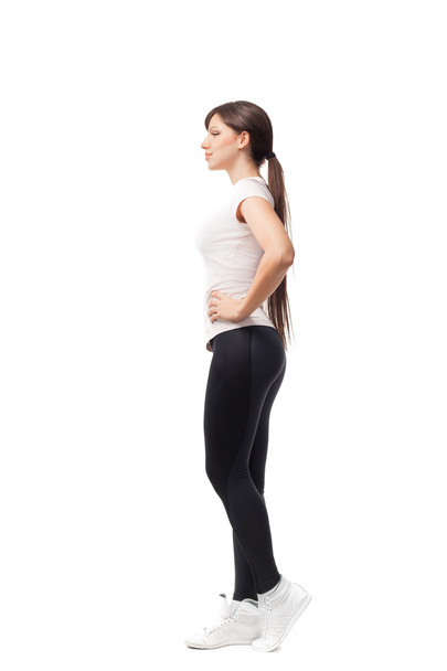 Fitness woman in sport style standing against white background. isolated - Fotó, kép