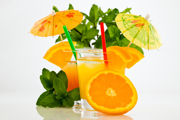 Soft drinks in rock glasses with a straw and umbrella - Zdjęcie, obraz