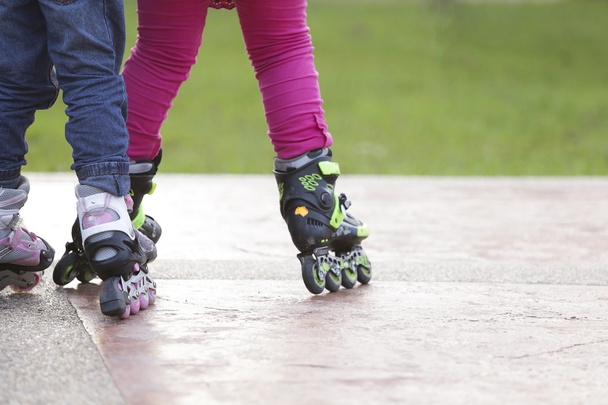 Kid playing a roller skater - Photo, Image