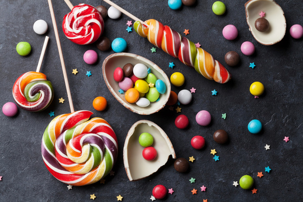 Colorful candies on stone background - Photo, Image