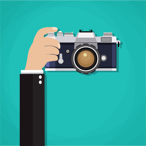 Flat illustration of photo camera with hand holding it - Вектор,изображение