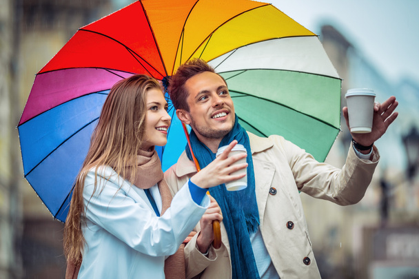 Smiling people with umbrella - Photo, Image