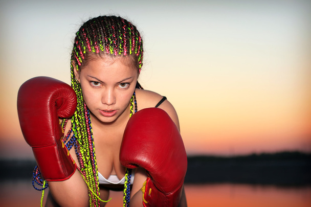 Portrait of a girl with red boxing gloves - Fotografie, Obrázek