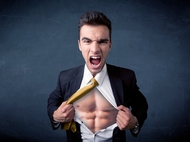 Businessman tearing off shirt and showing mucular body - Fotografie, Obrázek
