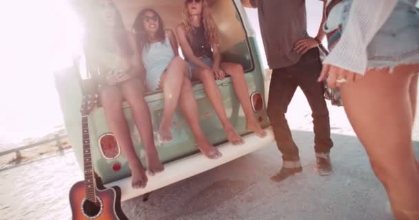 friends sit in back of open retro van - Footage, Video