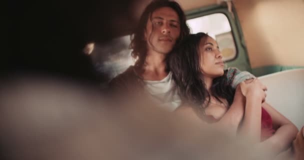 couple enjoying a road trip on vintage van - Filmati, video