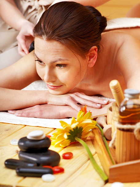 Woman getting stone therapy massage . - Photo, Image
