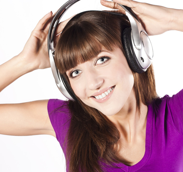 Pretty woman listening, and enjoying music - Zdjęcie, obraz