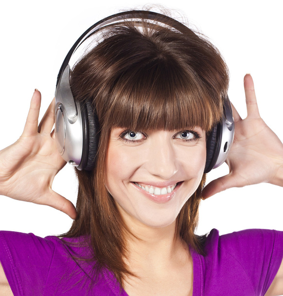 Pretty woman listening, and enjoying music - Фото, зображення