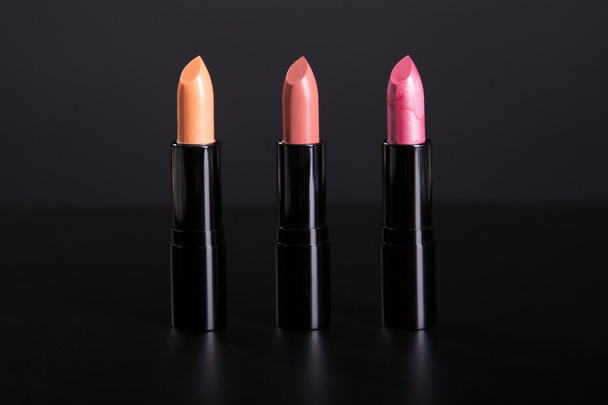 Row of trendy lipsticks in warm colors  - Zdjęcie, obraz