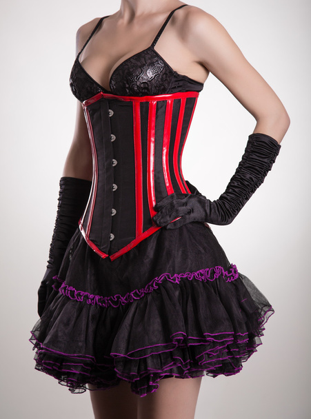 Beautiful woman in black and red corset  - Zdjęcie, obraz