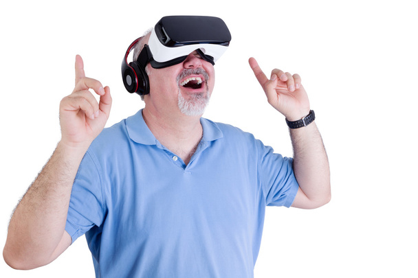 Excited man wearing virtual reality glasses - Foto, immagini