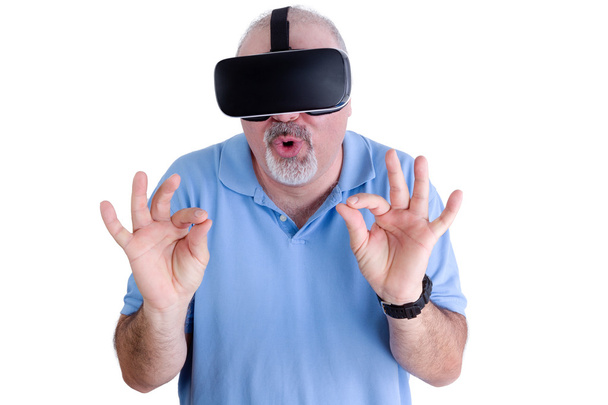 Man on white wearing virtual reality glasses - Valokuva, kuva
