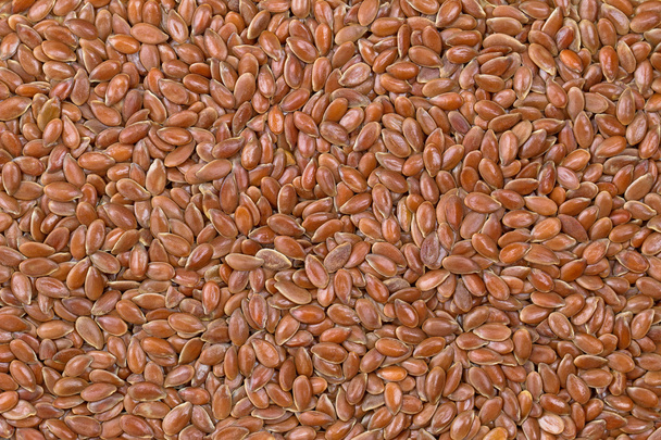 Texture photo of reddish brown seeds of Linseed, also called flaxseed - 写真・画像
