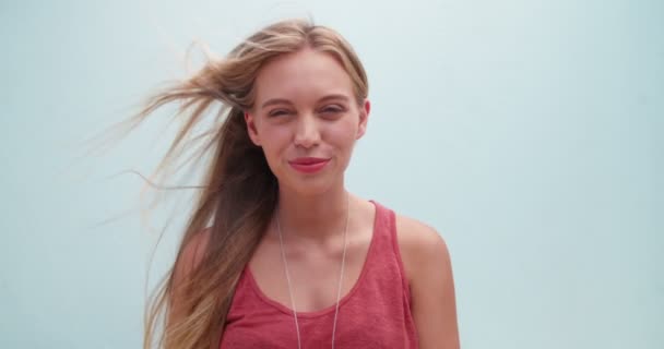 Portrait of a smiling young blond girl - Felvétel, videó