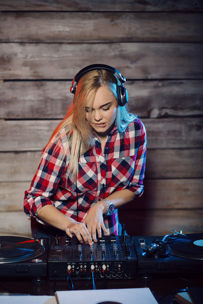 Cute dj woman having fun playing music at club party - Фото, изображение