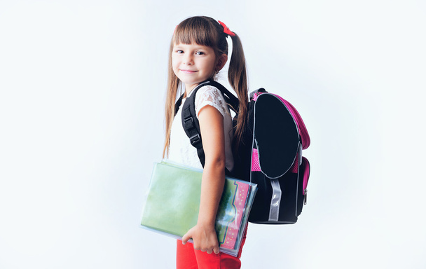 Portrait of teenager girl with school backpack holding colored f - Fotografie, Obrázek
