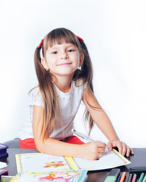 little girl schoolboy draws with colored markers - Foto, imagen