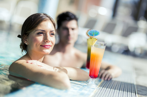 People drinking cocktails by the swimming pool  - Zdjęcie, obraz