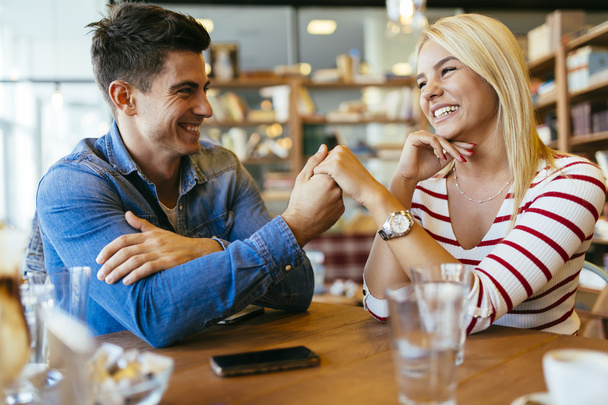 Beautiful couple in love flirting in cafe - Foto, immagini