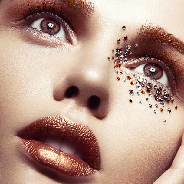 Beautiful girl with a gentle make-up and crystals on the face. C - Fotoğraf, Görsel