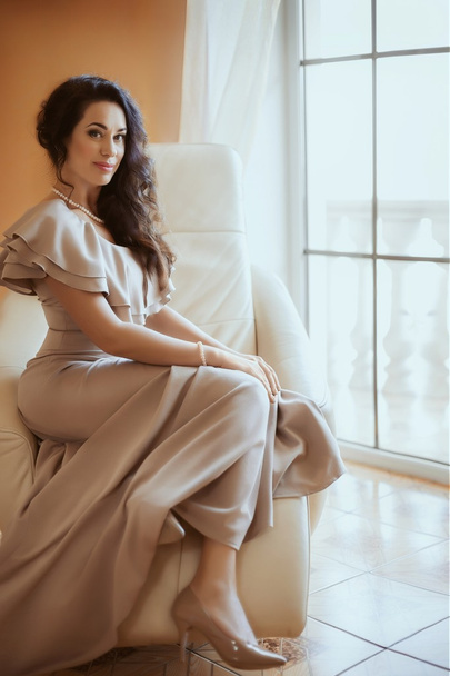 beautiful woman in the beige dress - Fotó, kép