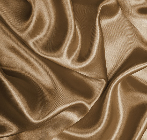 Smooth elegant golden silk as background. In Sepia toned. Retro  - Фото, зображення