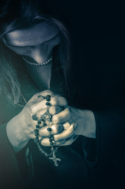 Closeup on a woman praying - Fotoğraf, Görsel