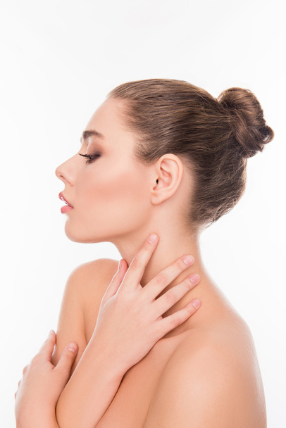 Side view portrait of  relaxed sensitive woman touching her neck - Foto, afbeelding