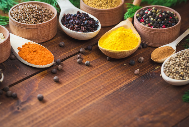 colorful spices in wooden spoons  - Photo, image
