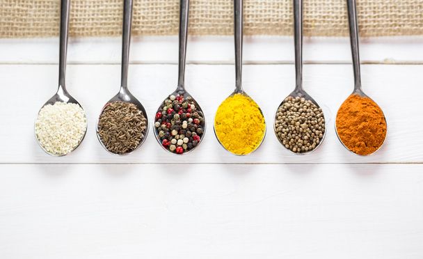 colorful spices in iron spoons - Zdjęcie, obraz