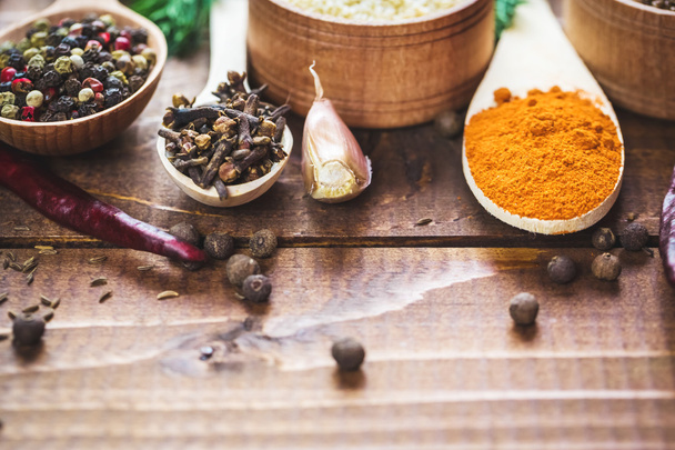 colorful spices in wooden spoons  - 写真・画像
