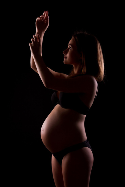 Young pregnant woman in black underwear - Foto, Imagem