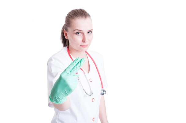 Woman doctor holding two fingers as penetration concept - Foto, Bild