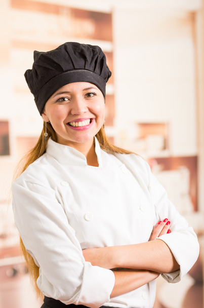 Great portrait of positive smiling woman chef in full cooking outfit - Photo, image