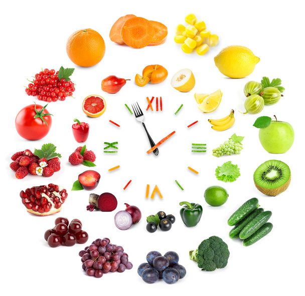 Food clock with fruits and vegetables - Foto, afbeelding