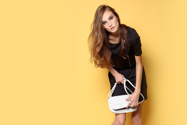 Trendy girl with bag - Фото, изображение