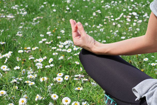 Woman meditating in yoga position in nature close up. - Fotó, kép
