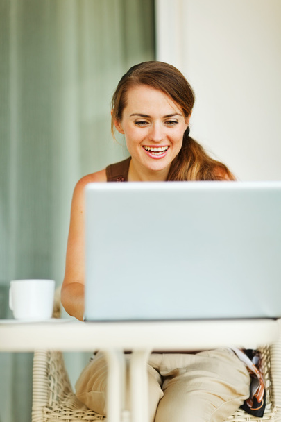 Beautiful woman working on laptop - Фото, изображение