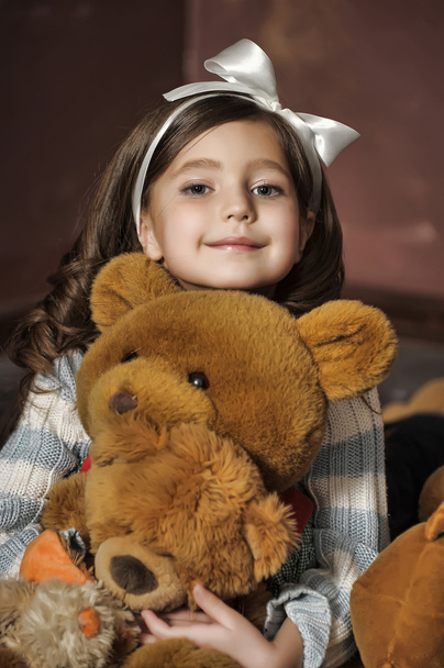 Girl with a teddy bear - Фото, изображение