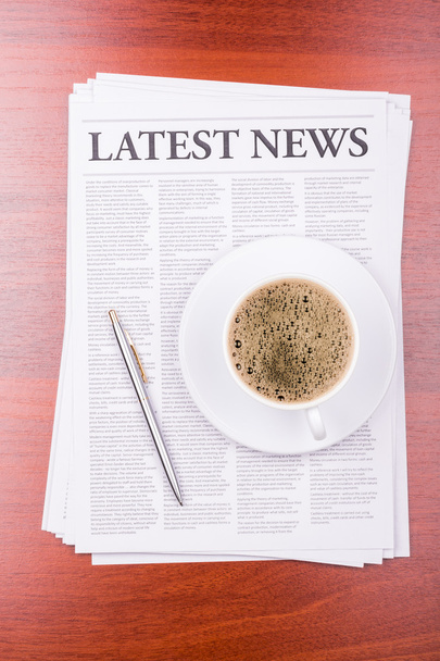 The newspaper LATEST NEWS on table and coffee - Фото, зображення