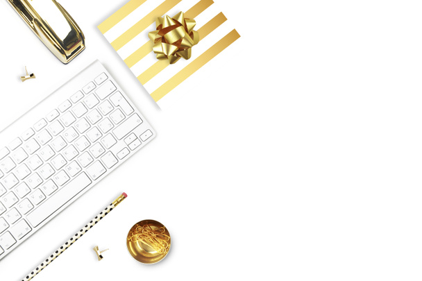Flat lay, office white desk and keyboard with gold stationery. Gold stapler, stripe gold pattern, pencil. View top. Table up. Mock-up background - Photo, Image