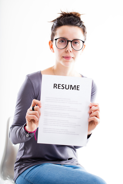 serious woman showing a resume - Photo, Image