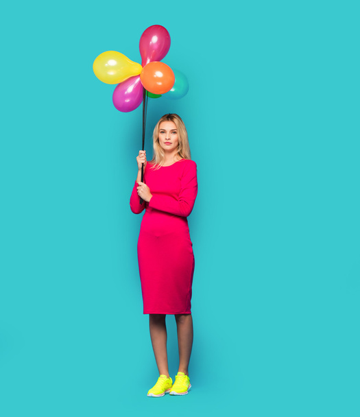 blonde woman with balloons on blue - Foto, immagini
