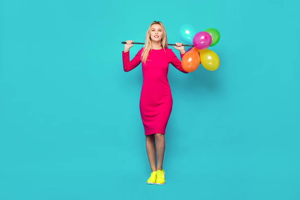 blonde woman with balloons on blue - Foto, Imagem