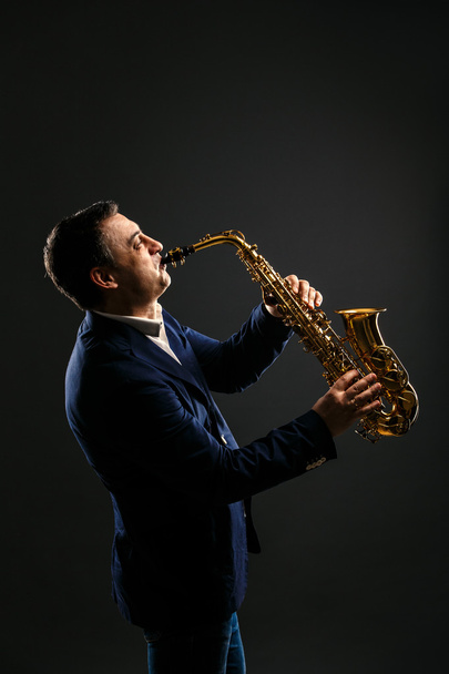 musician plays jazz at saxophone - 写真・画像